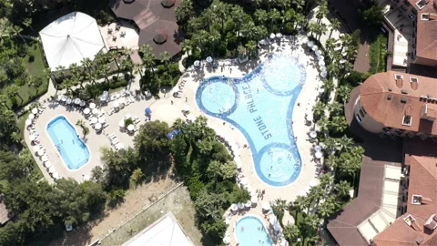 The hotel complex has a swimming pool and a bar with a restaurant. Top shot Stock-Footage 118679967