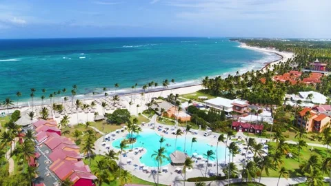 Hotel complex with a swimming pool and a beach by the sea from a bird's eye view Stock Footage 229797066