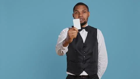 Hotel concierge presenting the room access key card after check in process Stock Photos