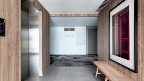 Hotel corridor interior showing elevator and waiting area. push forward Stock Footage 320614411