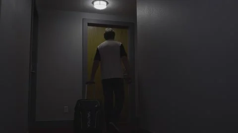 Hotel corridor. A man walking into his room. 스톡 동영상 140304367