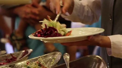 Hotel dining room. Guests Select Food From A Buffet. Video stock 76926619