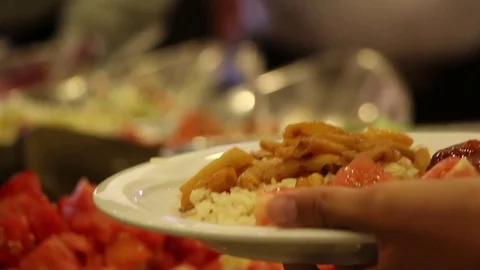 Hotel dining room. Guests Select Food From A Buffet. Stock Footage 76926620