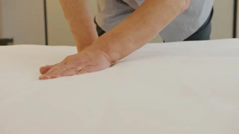 A hotel employee makes the bed Stock Footage 171413043