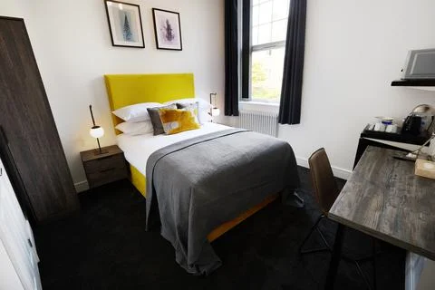 Hotel, empty room and accommodation with hospitality for vacation for journey Stock Photos