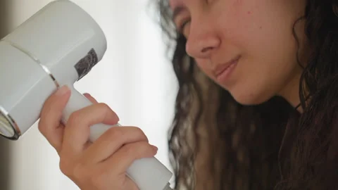 Hotel hair dryer. Closeup of handheld dryer details. Focus on dryer handle and Vidéo 331461953