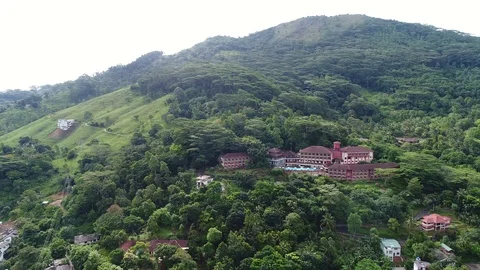Hotel in a hillside surrounded by trees Kandy Sri Lanka, aerial 4k Stock Footage 96775561