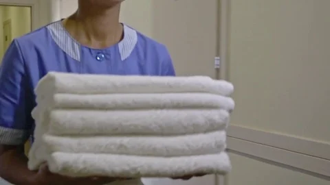 Hotel Housemaid with Clean Towels Stock Footage