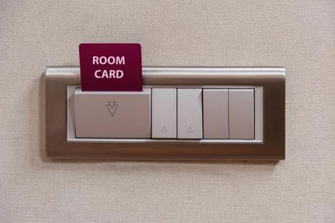 Hotel key card insert to power switch control of the electric and light switches Stock Photos