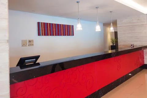 Hotel lobby with fully tiled flooring. Stock Photos