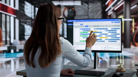 Hotel Manager Checks Booking System On Computer Stock Footage 347905158
