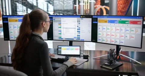 Hotel Manager Checks Reservation Data On Her Computer Screen. 스톡 사진
