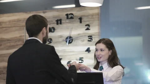Hotel manager receiving guest Stock Footage 61367730