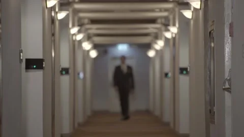 Hotel manager walking down hallway 60p Stock Footage 144587987
