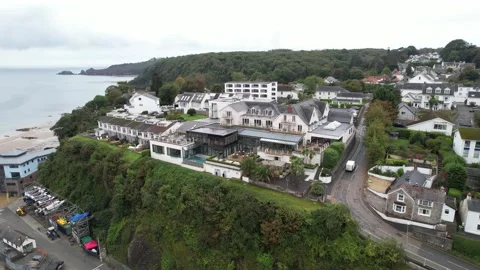 Hotel or spa complex near sea coast, vehicles driving on road around Stock-Footage 166648751