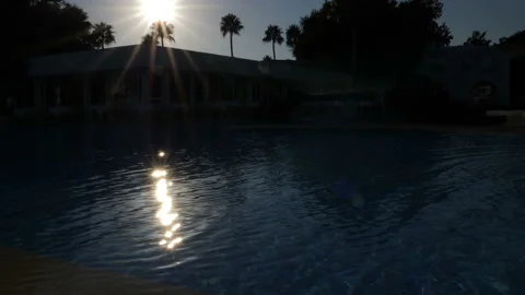 Hotel pool at sunset. Stock Footage 98021312