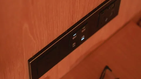 Hotel Power Access. Charging station with USB ports. Nightstand with sockets and Stock Footage 331459958