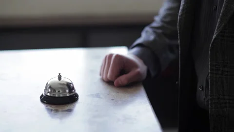Hotel Reception Bell Being Ringed By Guest Stock Footage 220666665