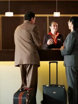 Hotel receptionist talking Stock Photos