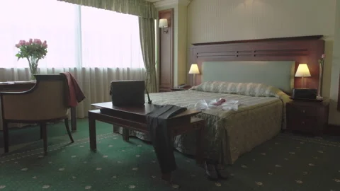 Hotel Room Interior and mans pants on the desk Stock-Footage 240764982