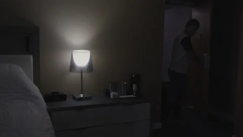 Hotel room, a man entering. Camera inside. 스톡 동영상 140484342