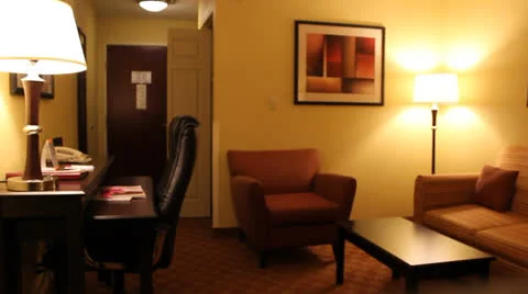 Hotel room studio couch sitting area to desk work area. Stock Footage 24757094