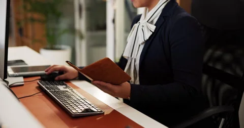 Hotel, schedule and typing with hands of concierge at welcome desk for check in Stock Footage 310652822