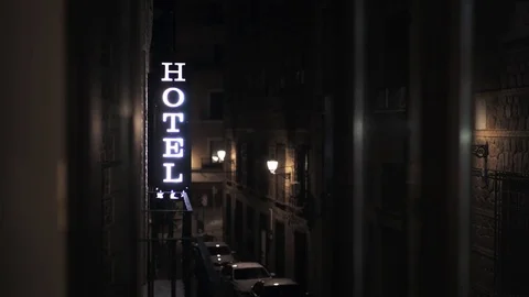 Hotel sign glowing in the night in a Spain street Stock Footage 78652653