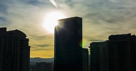 Hotel Silhouette from Setting Sun Backlit Time Lapse Stock Footage 64815607