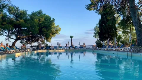 Hotel Swimming Pool Under Blue Skies Stock Footage 248000513
