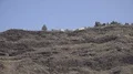Hotels and volcanic beach at Tazacorte cliffs tilt down in La Palma island Spain 4k or 4k+ Resolution