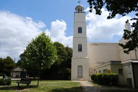 Hotham Park Clock Tower and Park Bench in Bright Summer Sunlight,Bognor Regis Stock Photos