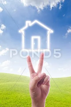 Houes icon on two fingers Stock Photos
