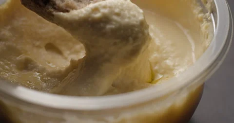 Houmous bread dipping close-up slow motion Stockbeeldmateriaal 280520737