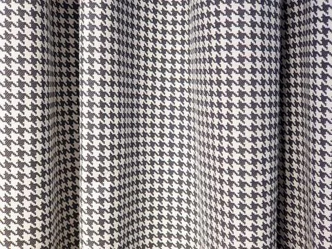 Houndstooth check pattern Fabric. Suit polyviscose fabric. Black and white Fotos Stock