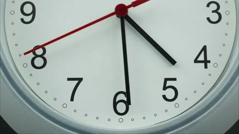 The hour hand points between 4 and 5. The minute hand points between 7 and 8. Video stock 230117313