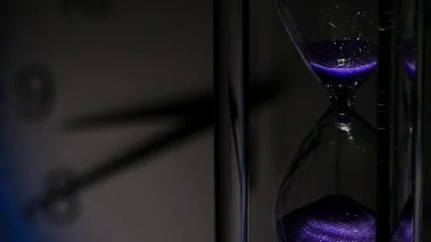 Hourglass and a clock face 스톡 동영상 70184962
