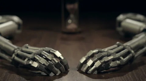 Hourglass and two robot arms. Dolly slider shot Stock Footage 67407445