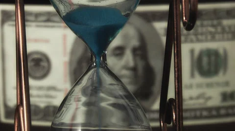 Hourglass on the background of dollar bills Stock Footage 39654918