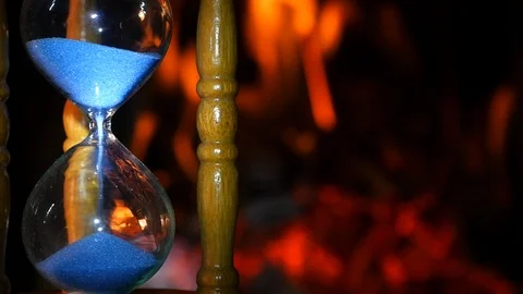 Hourglass on the background of fire Stock Footage 86937992