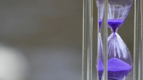 Hourglass on the background of the river 스톡 동영상 277476450