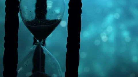Hourglass on a beautiful background Stock Footage 164678364