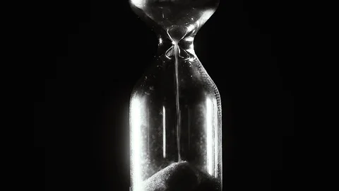 Hourglass. Black and white. Countdown. Slow motion. Video stock 105294332