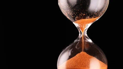Hourglass on a black background Stock Footage 115092020