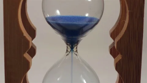 Hourglass with blue sand. Close-up Stock Footage 72167973