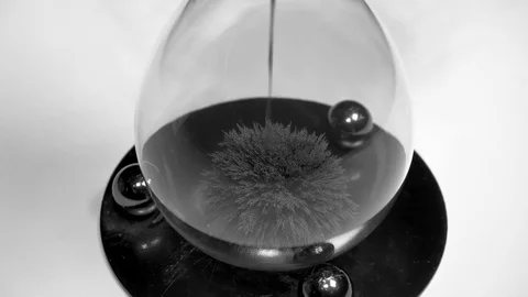 Hourglass Close-Up - Iron Particles Magnetization - Time lapse Video stock 99009615