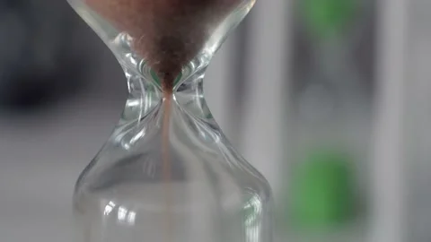Hourglass. Close-up. Sands move through hour glass. Sandglass. 스톡 동영상 179886544