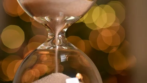Hourglass close-up. Time flows, the transience of time. Sand pouring throug.. Stock Footage 226223028