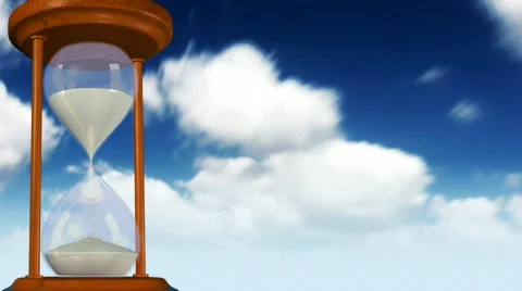 Hourglass with clouds in the background. Stock Footage 325134