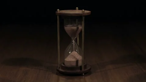 Hourglass on dark background Stock Footage 67408836